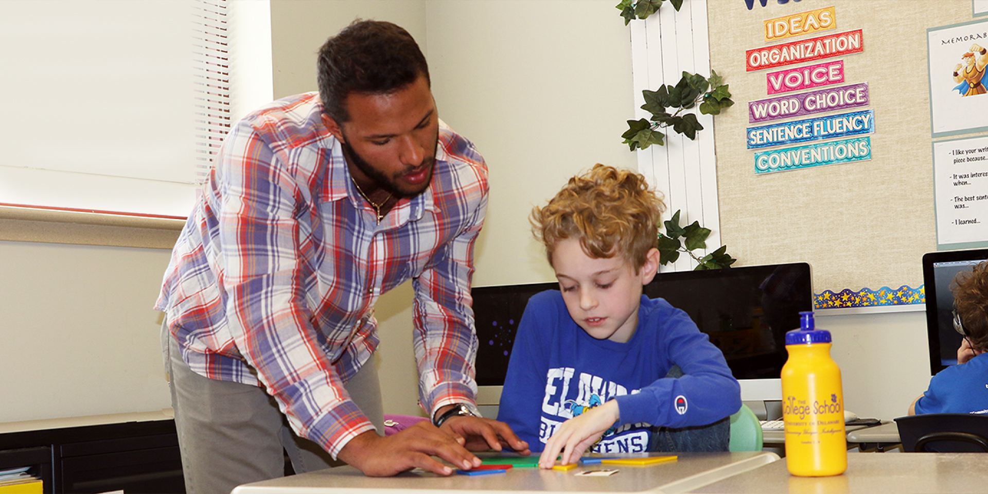 Student teacher teaches math to student at The College School