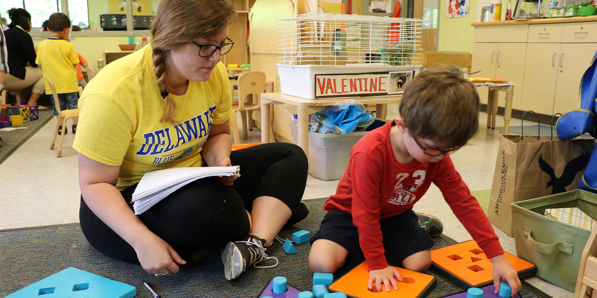 Student observes child at the Early Learning Center